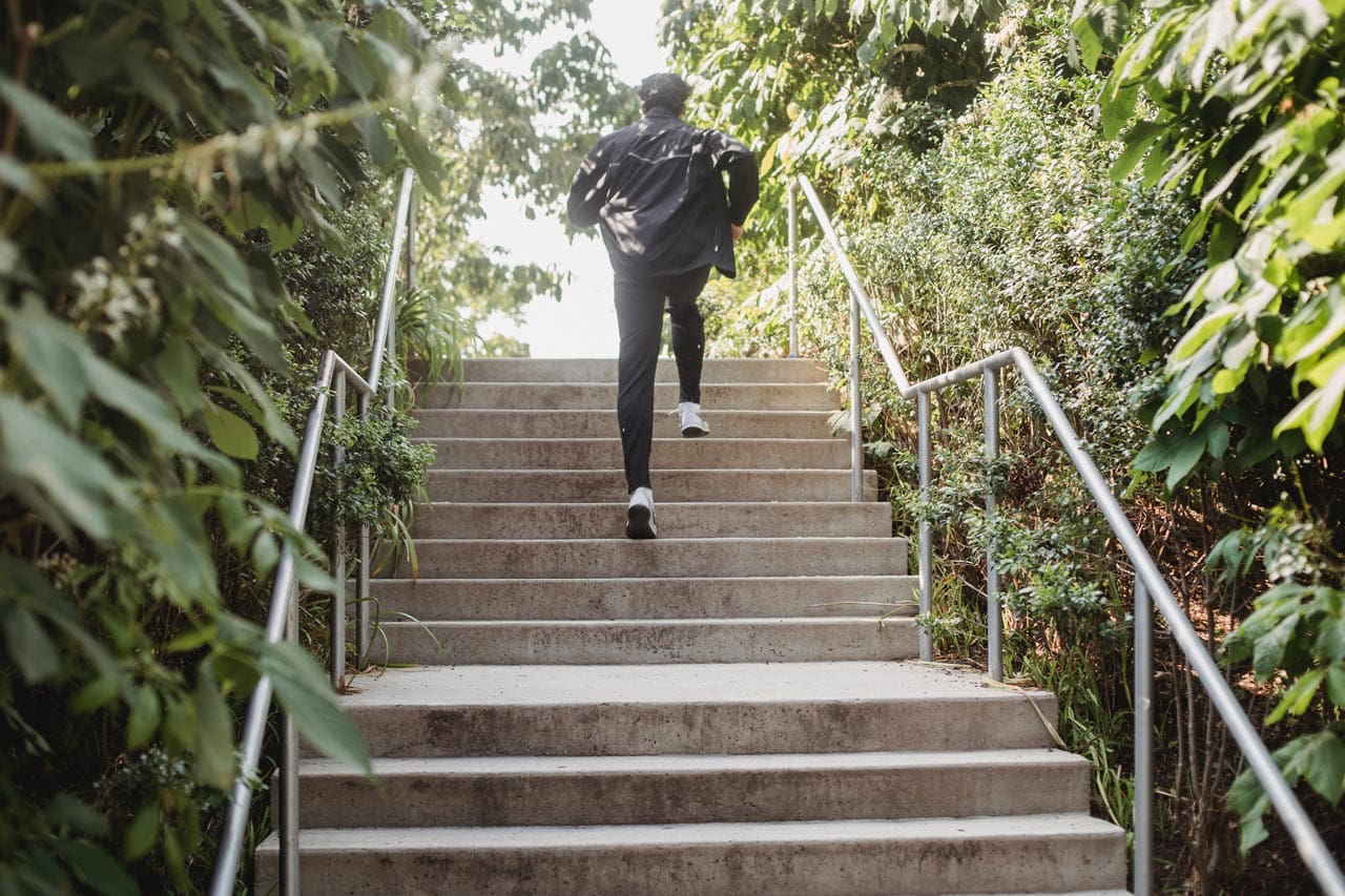 man running up stairs