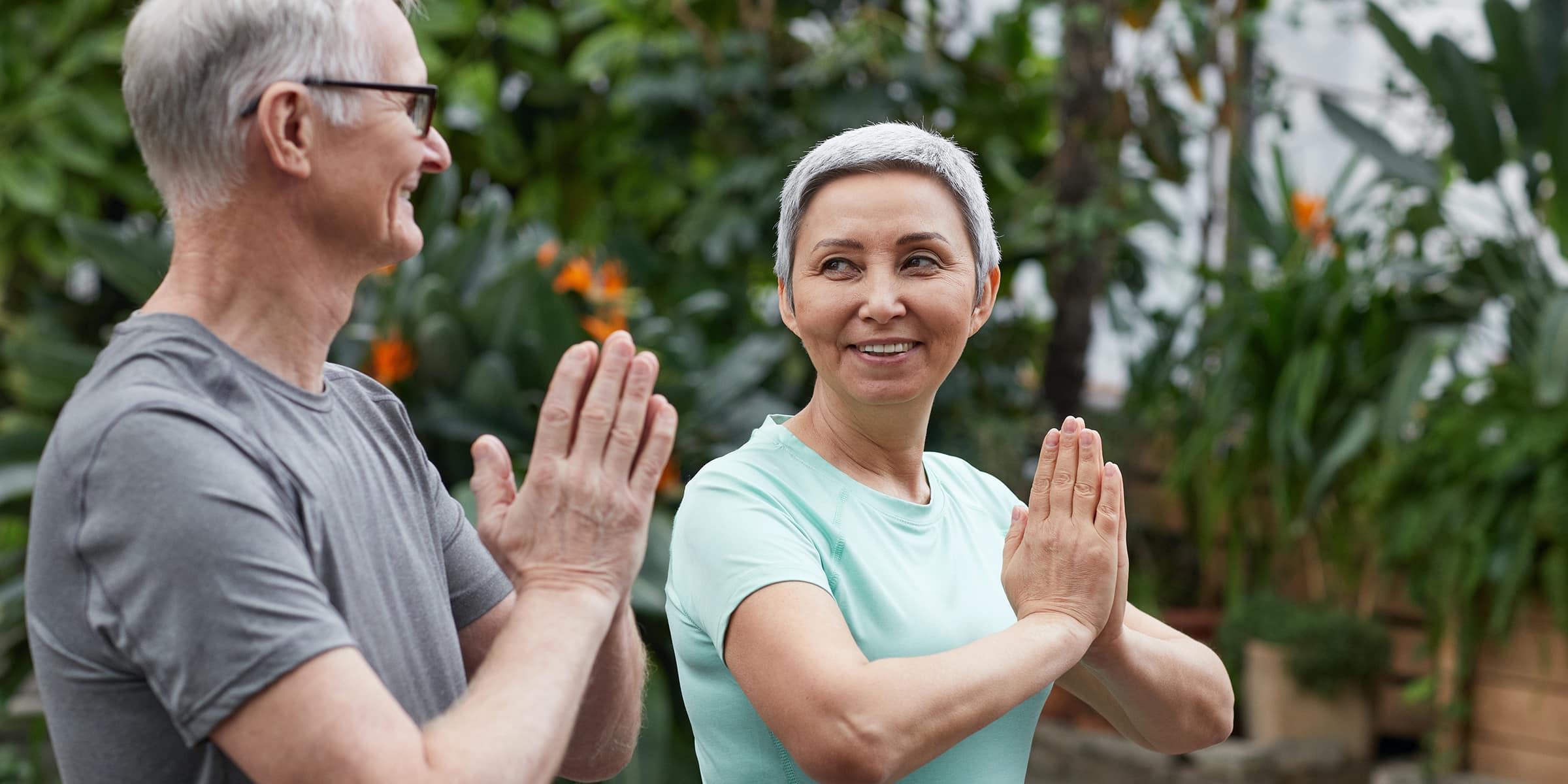 Two senior people in a Tai Chi practice