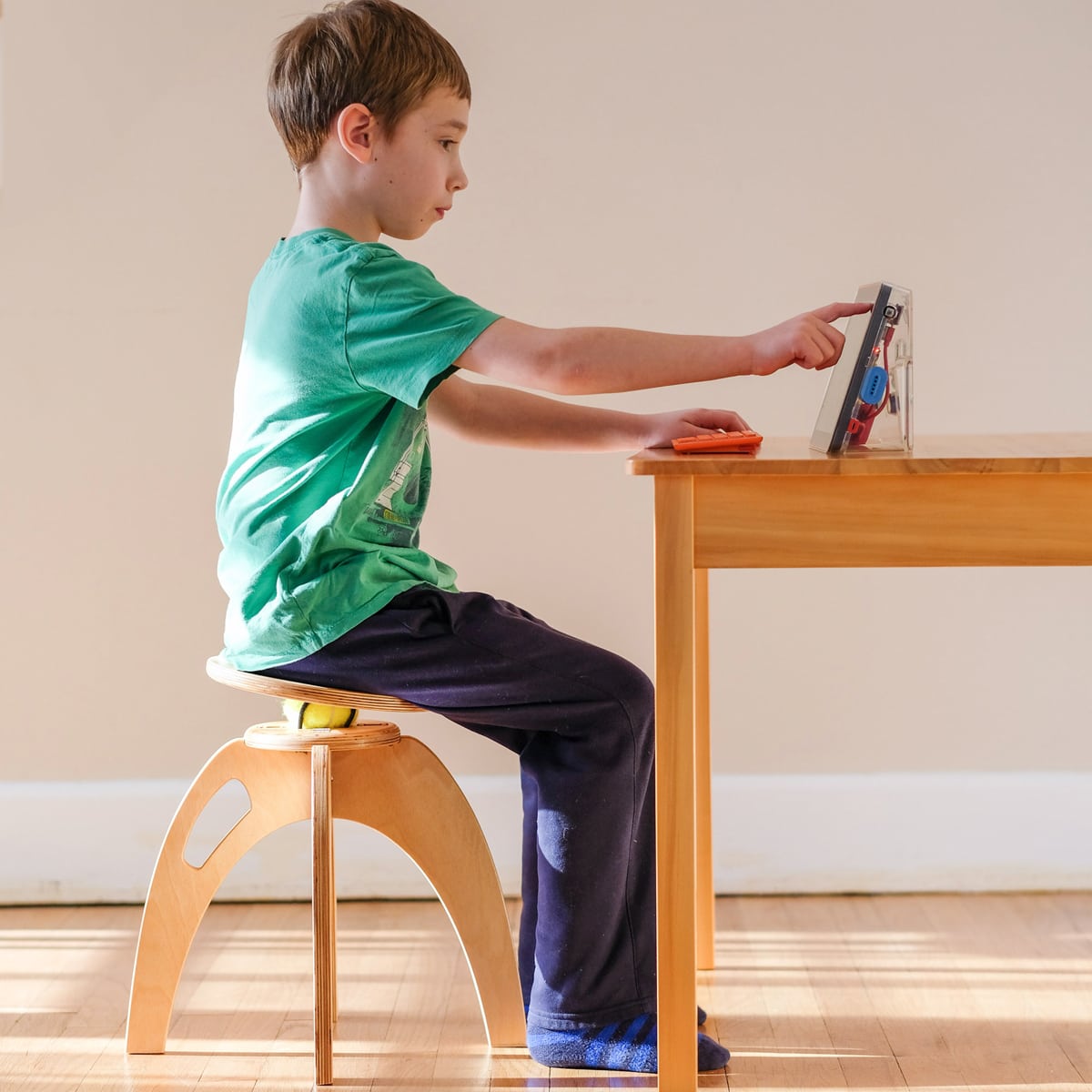 Kid sitting 2024 on a chair